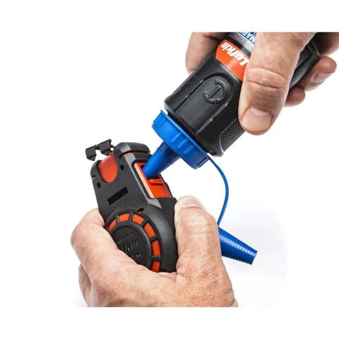 Hands filling Compact 50 ft chalk reel with blue chalk for fast, precise straight line marks in construction, drywall, and carpentry