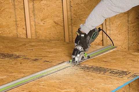Person using 5.8 Amp Compact Circular Saw Kit With Laser Guide, Plunge Cut Depth Control, on a wooden board for precise cutting