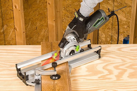 5.8 Amp Compact Circular Saw Kit With Laser Guide cutting wood, showing plunge cut depth control and miter base system in use.