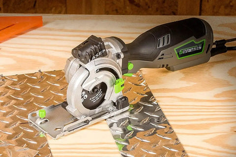 5.8 Amp Compact Circular Saw Kit With Laser Guide cutting metal sheet on wooden workbench