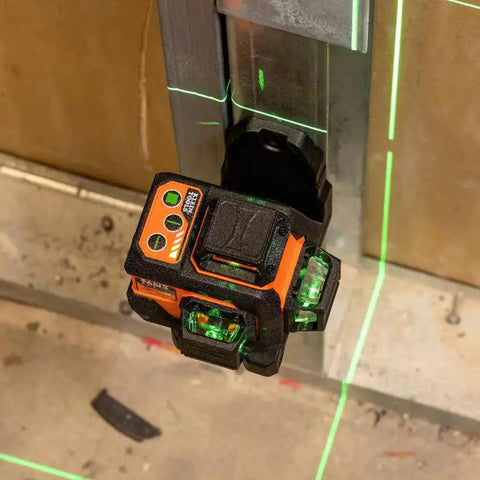 Compact self-leveling laser level with bright green cross lines and 360-degree planes delivers precise alignment for construction and carpentry, up to 100 ft range, magnetic mount, rechargeable, class 2 safety installed on metal surface