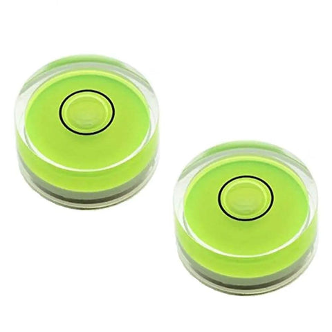 Two compact green round mini spirit levels with clear acrylic housings for precise bubble readings and alignment in tiny projects.