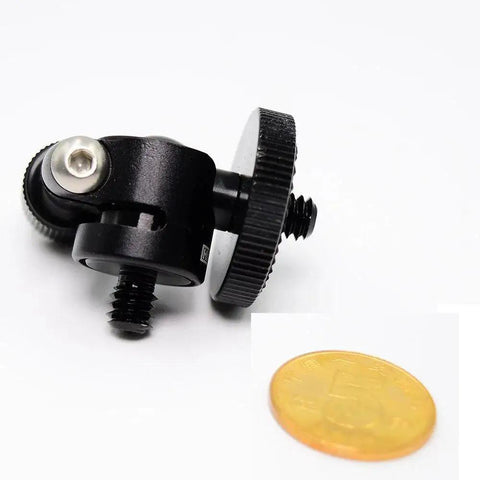 Compact Mini Ball Head Tripod Mount with 1/4 inch screw, black aluminum, seen with coin for scale, supports 360 degree rotation.