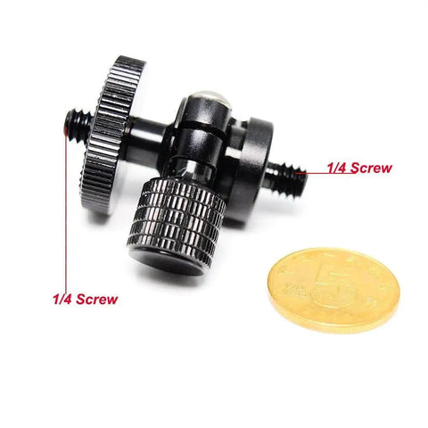 Compact Mini Ball Head Tripod Mount With One Quarter Inch Screw Connector for Cameras and DSLRs next to a coin for scale