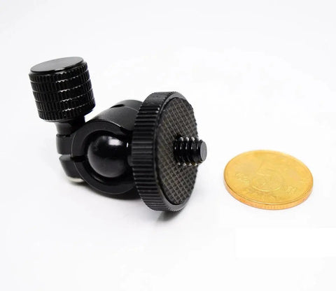 Compact Mini Ball Head Tripod Mount with One Quarter Inch Screw Connector next to coin, supports 360 degree rotation