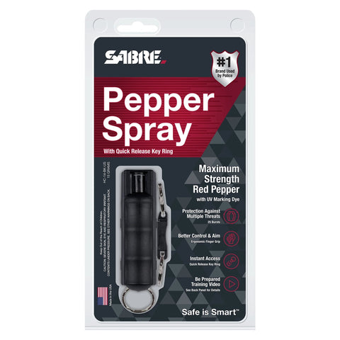 Compact police-strength pepper spray with quick release keychain for fast access, displaying secure grip and UV dye.