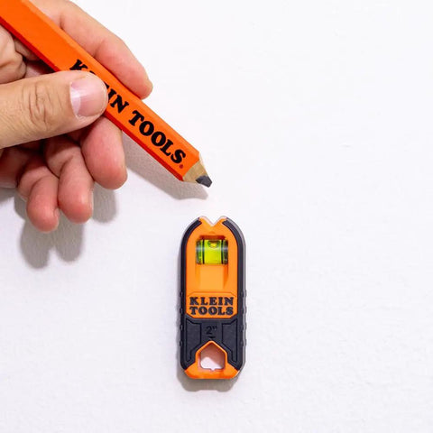 Compact Magnetic Stud Finder And Level With Bubble Vial for wood and metal detection shown on drywall surface.