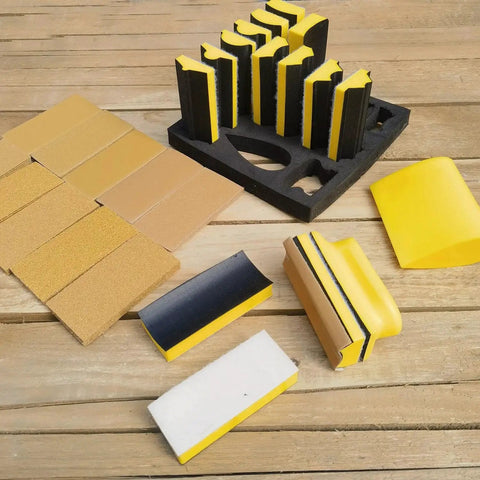 16 Contoured Sander Blocks With 40 Sheet Sandpaper For Woodworking Moldings displayed on a wooden surface