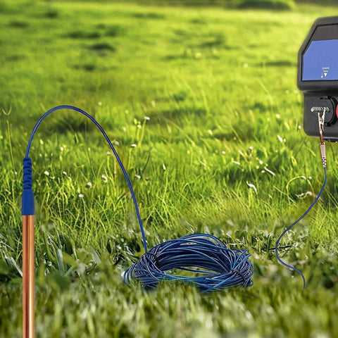 Ultimate 24 Inch Pure Copper Ground Rod Kit With 50 Foot Copper Wire And Alligator Clip in a grassy setting