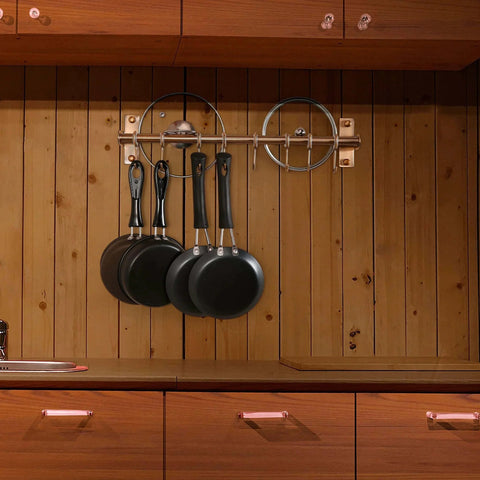 Kitchen Utensil Holder Hanger, Pot and Pan Rack Wall Mount with pans hanging, stainless steel antique copper rail installed on wood wall.