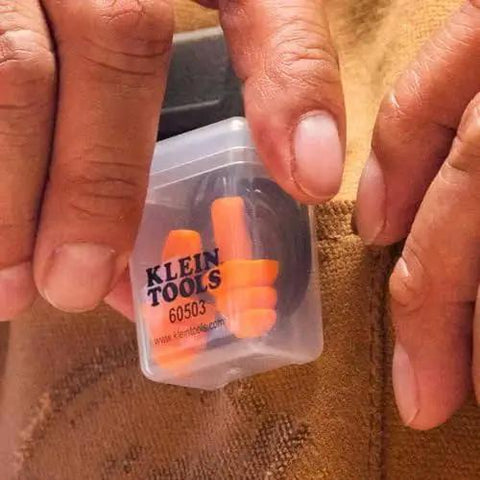 Corded Reusable Earplugs With 25dB NRR In Bright Orange Case Included For Construction And Loud Environments in hand
