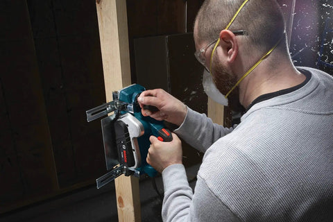 Man using Renewed 120V corded planer delivers precise three and a quarter inch capacity for flattening and smoothing boards, 16,500 RPM, 6.5A performance, and includes stand with a dual-guide fence for accurate surfacing, door trimming, and stock prep in shops.