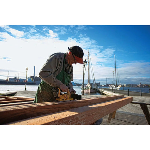 Worker using Cordless 20V Max Planer Bare Tool Only With 30,000 CPM And 2 Mm Cut Depth Brushless Motor outdoors on job site
