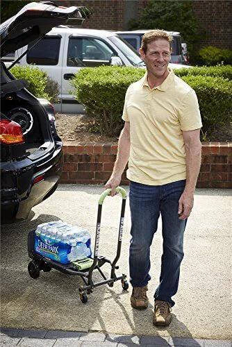 Man using COSCO Shifter Multi-Position Folding Hand Truck and Cart, 300 lb. Weight Capacity, Green, 12222PBG1E