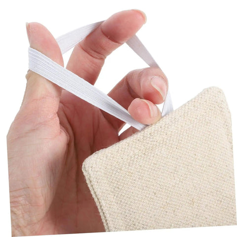 Close-up of hand holding beige cotton door damper and slam silencer set, reduces noise, prevents slams, protects walls and fingers.