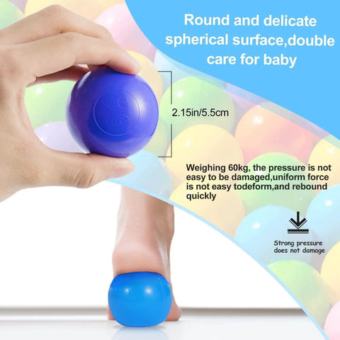 Hand holding a colorful ball pit ball highlighting non-toxic, crush-proof design with pressure demonstration text, Colorful Ball Pit Balls 100pcs for Kids, BPA & Phthalate Free, Crush Proof and Non-Toxic, Plastic Balls for Ball Pit with Reusable Net Bag - Perfect for Play Tents & Parties.