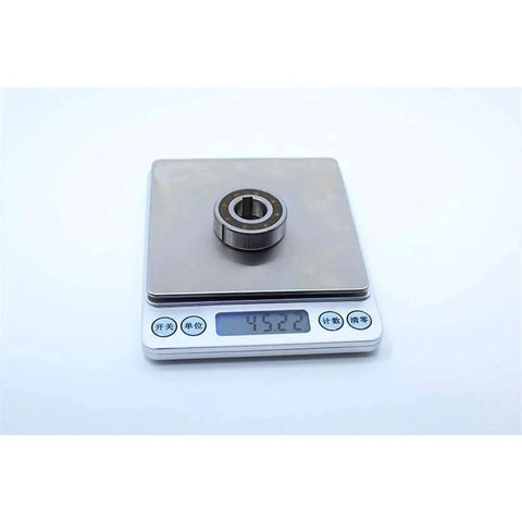 CSK15PP One Way Bearing Clutches 15 * 35 * 11mm with Keyway CSK6202PP on scale showing weight in grams