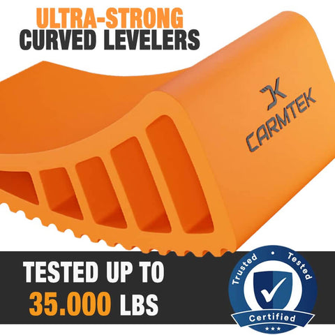 Pro Grade Camper Leveler Kit With Curved RV Levelers Wheel Chocks Rubber Mats And Carry Bag For Tight Dual Axle Trailers Faster RV Leveling System Than Blocks Includes Patented Anti Slip Jointing For Secure Leveling orange curved leveler close-up showing certification.