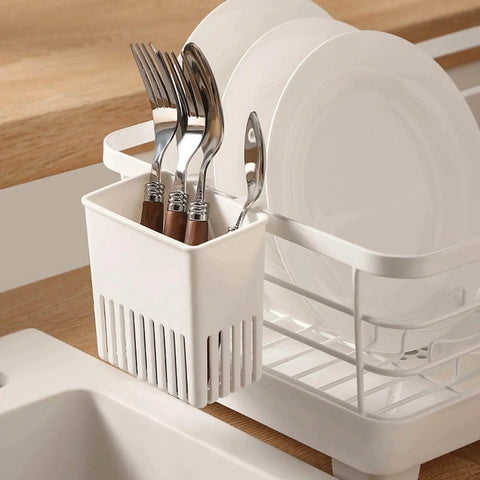 Cutlery Drying Rack - Utensil Drainer with forks and spoons hanging on a dish rack near the sink