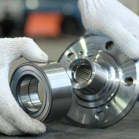 Hands holding MR84-2RS deep groove ball bearing next to gear, 4mm inner dia, 8mm OD, 3mm bore, double sealed chrome steel Z2, 10pcs