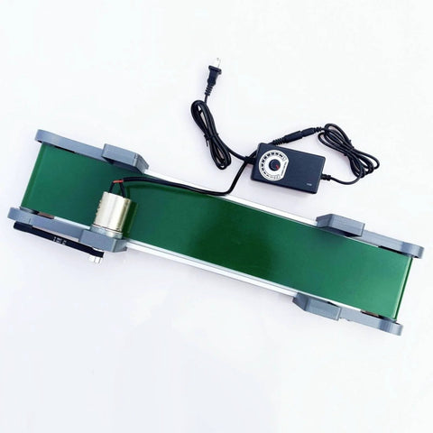 Top view of a Desktop Belt Conveyor with Stepless Speed Control for Packaging Factories and Assembly Lines, featuring green belt and control knob.