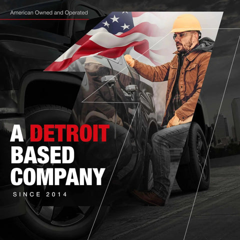 Worker in hard hat with American flag background and truck; text reads 'A Detroit Based Company Since 2014'
