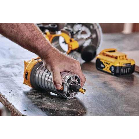 Person adjusting DEWALT 20V Max XR Cordless Brushless Router on workbench, showing variable speed and dual LEDs for woodworking.