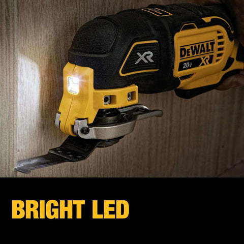 DEWALT 20V MAX XR Cordless Oscillating Multi Tool with bright LED light cutting wood surface