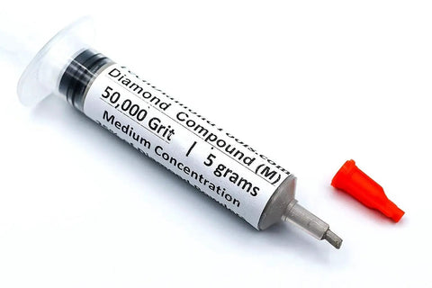 Oil based diamond polishing paste with 50,000 grit and 25 percent diamond powder in a syringe with red cap.