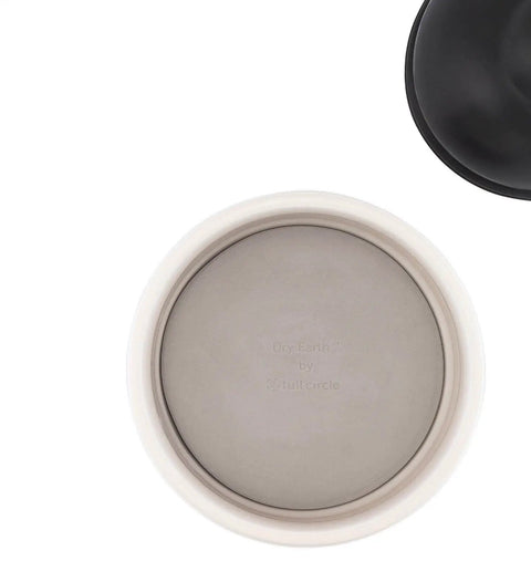 Top view of Absorbent Dry Earth Disk Refill for Toilet Brush Holder With Diatomaceous Earth in ceramic base, showing fit and design.