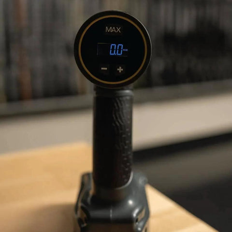 Close-up of the Wrench AutoTorque Screwdriver with Digital Display, Integrated Torque Limiter, for Gunsmithing on a wooden surface.