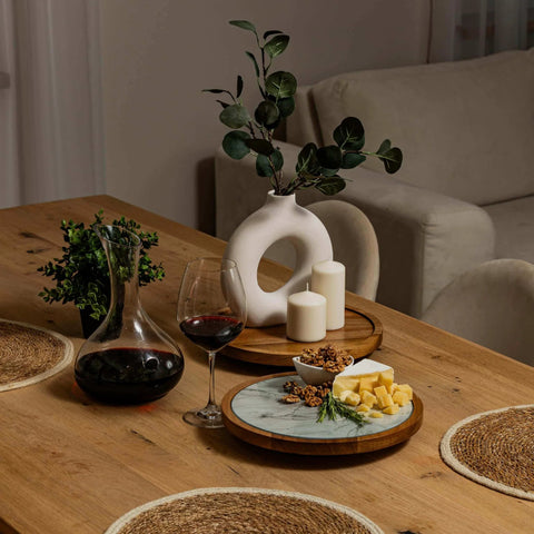 Table setting featuring a 12 inch acacia wood lazy susan turntable with removable glass plate, serving cheese and snacks.