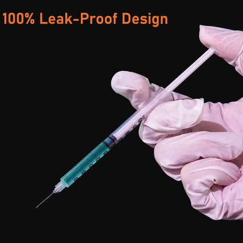 Gloved hand holding Disposable 1ml Syringe With Cap 31G One Quarter Inch 6mm Sterile Individually Packed Pack Of 20 showing leak-proof design