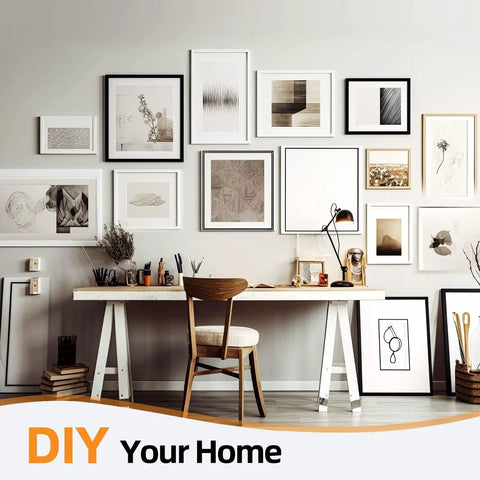 Gallery wall with various framed artwork above a wooden desk in a home office setting.