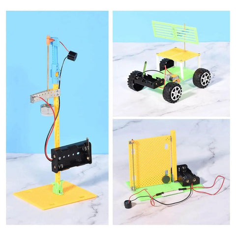 Educational DIY robotics kit with components for building a vertical crane, wheeled vehicle, and solar panel model on marble surface.
