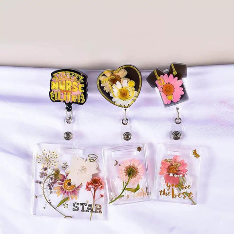Doctor Badge Rollers Silicone Molds For Epoxy Resin Crafting Heart Tooth And Stethoscope Shapes displayed on lanyards