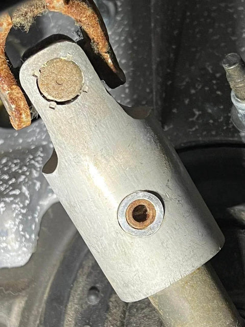 Close-up of Hardened 6061-Billet Intermediate Shaft Bushing Steering Column Sleeve in aluminum, installed in Dodge Ram.