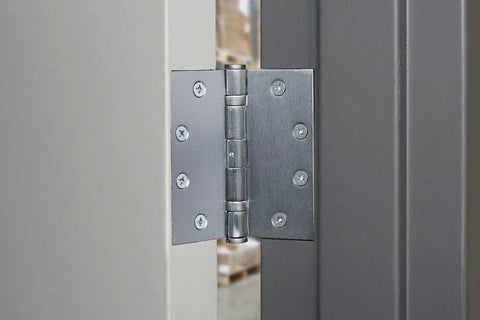 Commercial 4 Pack 4.5 Inch Ball Bearing Door Hinges Satin Chrome Finish installed on metal door frame