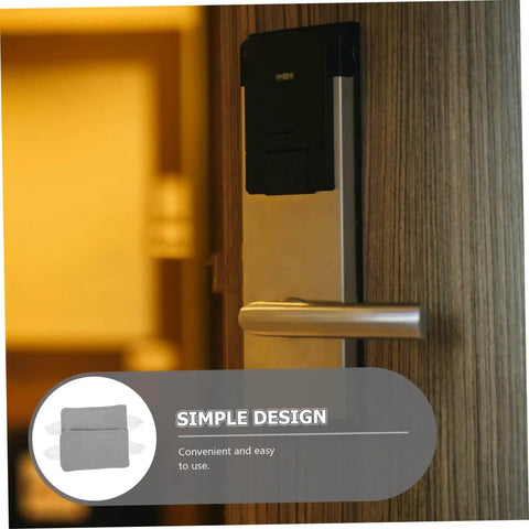 Two door silencers with elastic bands reduce noise and protect doors in nurseries, bedrooms, offices, and libraries; no drilling required, simply suspend on the door knob for damage-free, quiet environments, shown on a modern door handle.