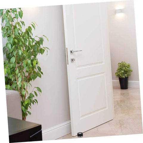 Image of a white door with a two piece door silencer set cushions door impact, protects walls and hardwood floors, prevents knob damage with no drilling, easy install anti collision stopper for quieter, safer living spaces, installed at the base, surrounded by home decor.