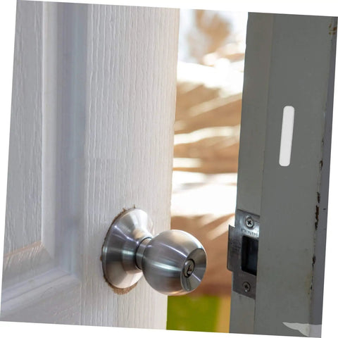 Interior door with knob slightly ajar, showcasing 12 Pcs Door Slam Silencer Silicone Cabinet Door Bumpers Adhesive Closers Wall Protectors for home.