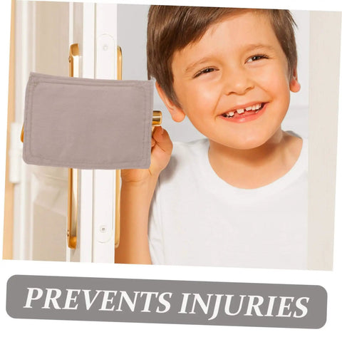 Child smiling next to a door with the Three Piece Safety Door Stopper Set With Elastic Straps Cushions Doors, Prevents Slamming.