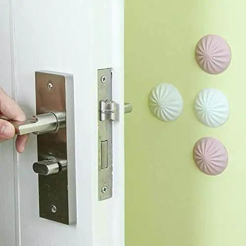 Silicone Door Stopper And Wall Protector Pad for Quiet Homes Anti Collision Cushion with decorative pads on a wall behind door handle.
