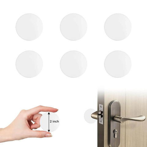 Self adhesive six piece door stopper set in medium 2 inch size cushions impact, prevents door slams, shown installed on door.