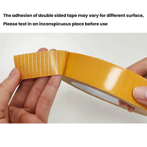 Hands holding Heavy Duty Double Sided Fabric Tape For Carpets And Rugs Crazy Sticky For Home And Office Use Secures Doormats Cushions