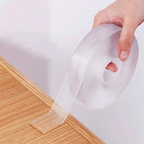 Double Sided Nano Tape 2 Inch By 33 Feet Heavy Duty Mounting Gel Tape Clear Traceless rolled out on wooden surface