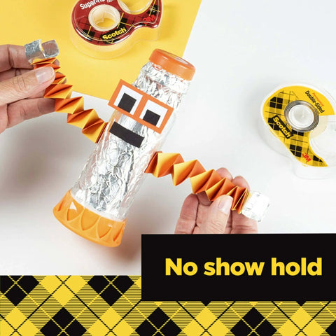 Hands crafting a robot with Double Sided Tape For Gift Wrapping And Crafts With Mess Free Bonding Adhesive, 0.50 In By 500 In.
