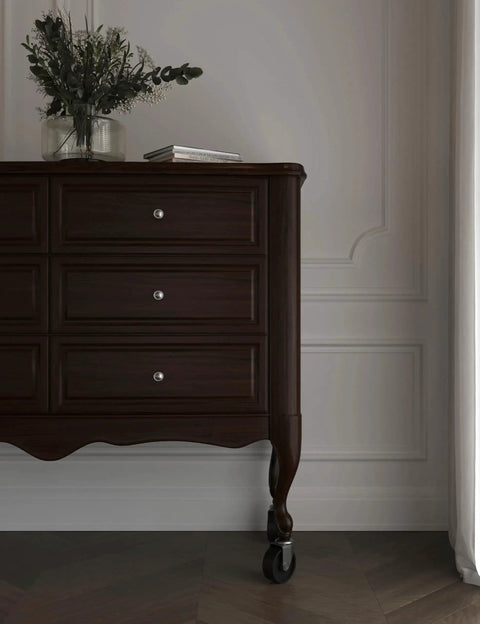 Dark wood dresser with 2 Inch Wood Furniture Caster Wheel With One Quarter Inch Stem For Tables Sofas Chests Dressers Cabinets Carts And Chairs Brass Plated Steel Frame Hardwood Wheel installed.