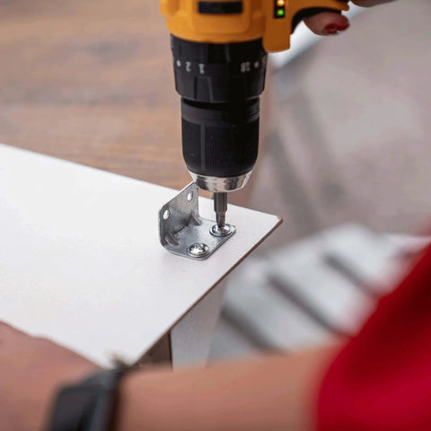 Drill fixing a metal bracket with bolts on a board, using 113 Piece Bolts Nuts And Washers Assortment Kit Galvanized Iron Hardware Set For Home Repair.
