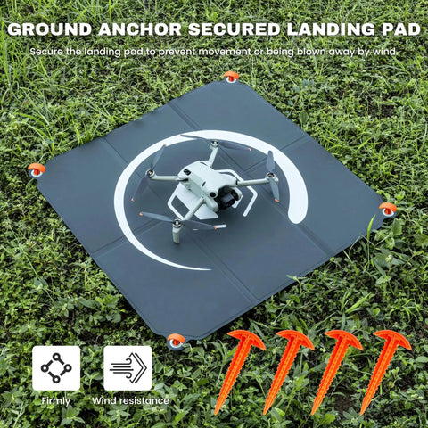 Foldable 22 Inch Drone Landing Pad With Fast Fold System 2x3 Double Sided Waterproof Launch Pad Weighted Helipad Blue Gray Durable Universal Pad for Mud Sand Snow Easy Rinse Clean Ready shown with drone on grass and ground anchors